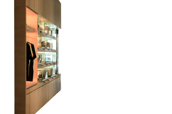 Retail display wall with illuminated shelving - Piranha Tattoo Studios