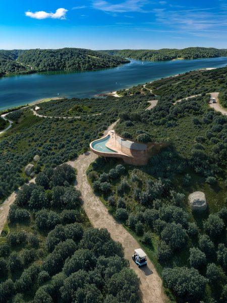 Aerial view of modern observatory overlooking forest and river - QVVV Master Plan