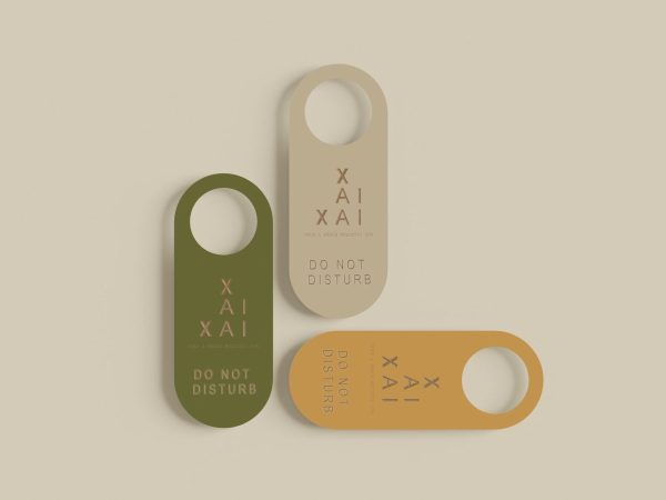 Minimalist “Do Not Disturb” door tags in neutral and earthy tones - Xai-Xai hotel