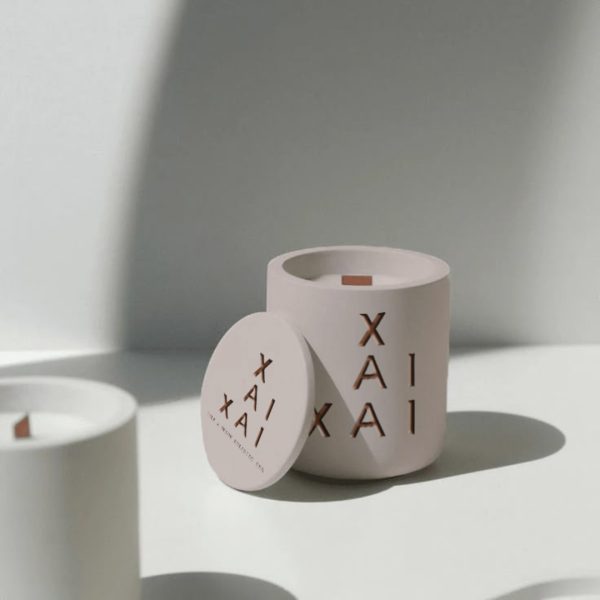 Minimalist ceramic containers with XAI copper lettering - Xai-Xai hotel